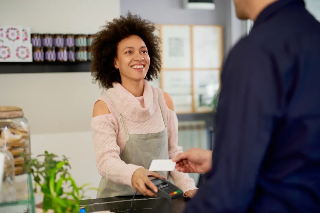 Friendly woman serving a customer
