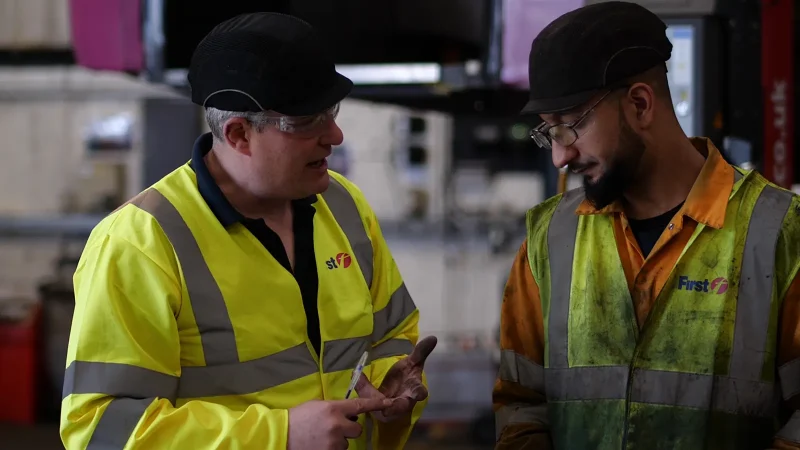 Supervisor and operative discussing safety on site during behavioural safety training